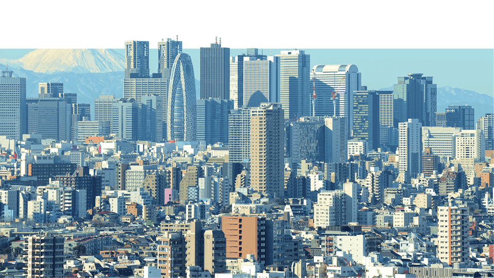 An expansive shot of Tokyo city skyline with Mount Fuji in the background.