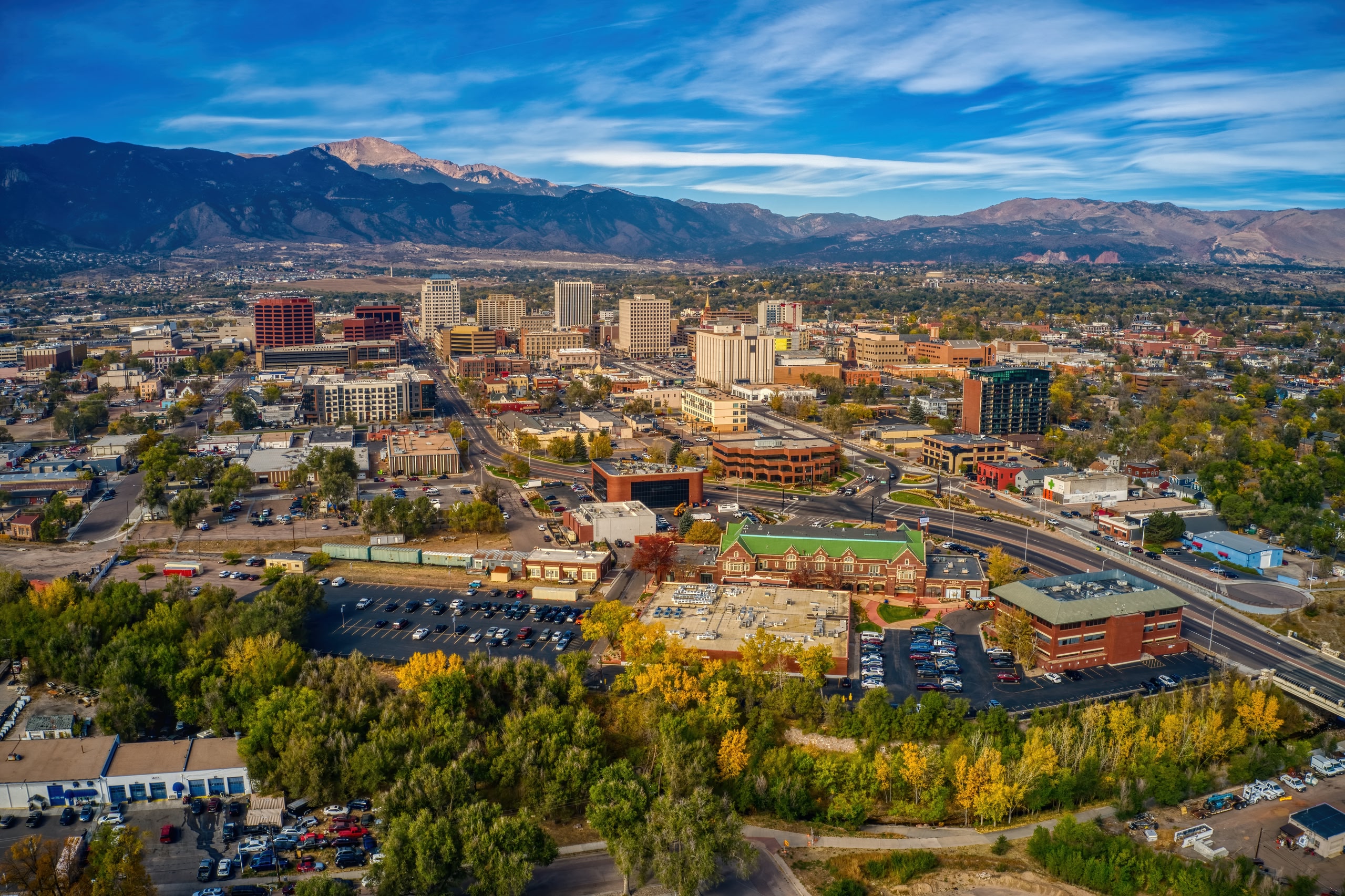 Aerial View of Colorado Springs with autumn colours and blue sky.