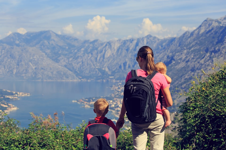 Mother and two children soaking up the view in Montenegro