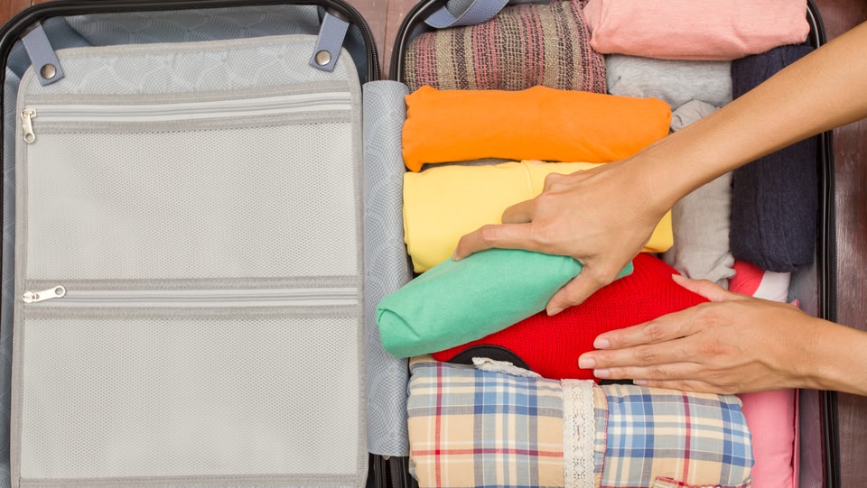 A suitcase being packed