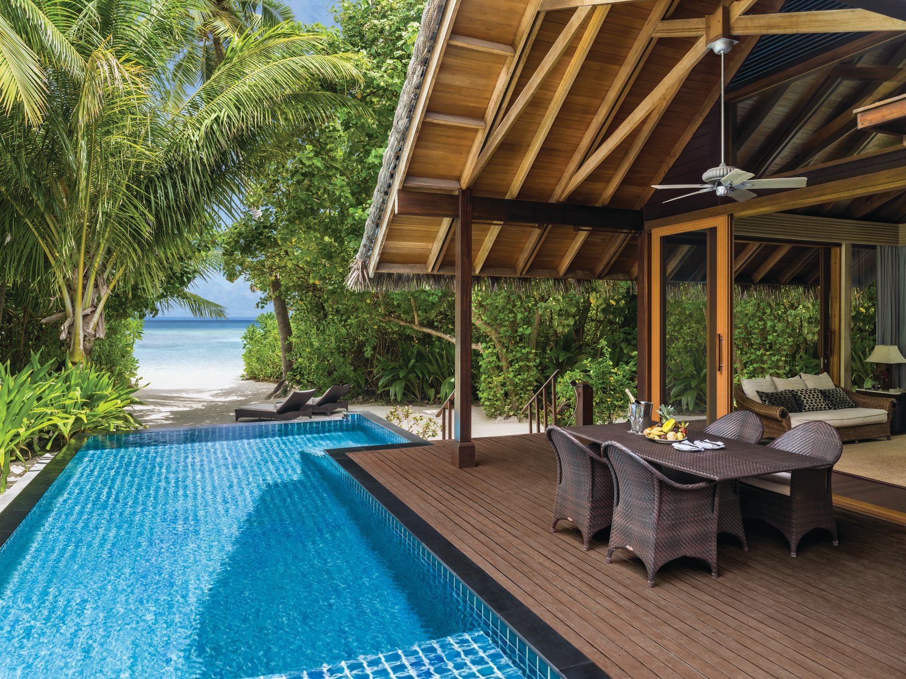 A pool-side patio at the Shangri-La makes for a sun-filled all-inclusive vacation.