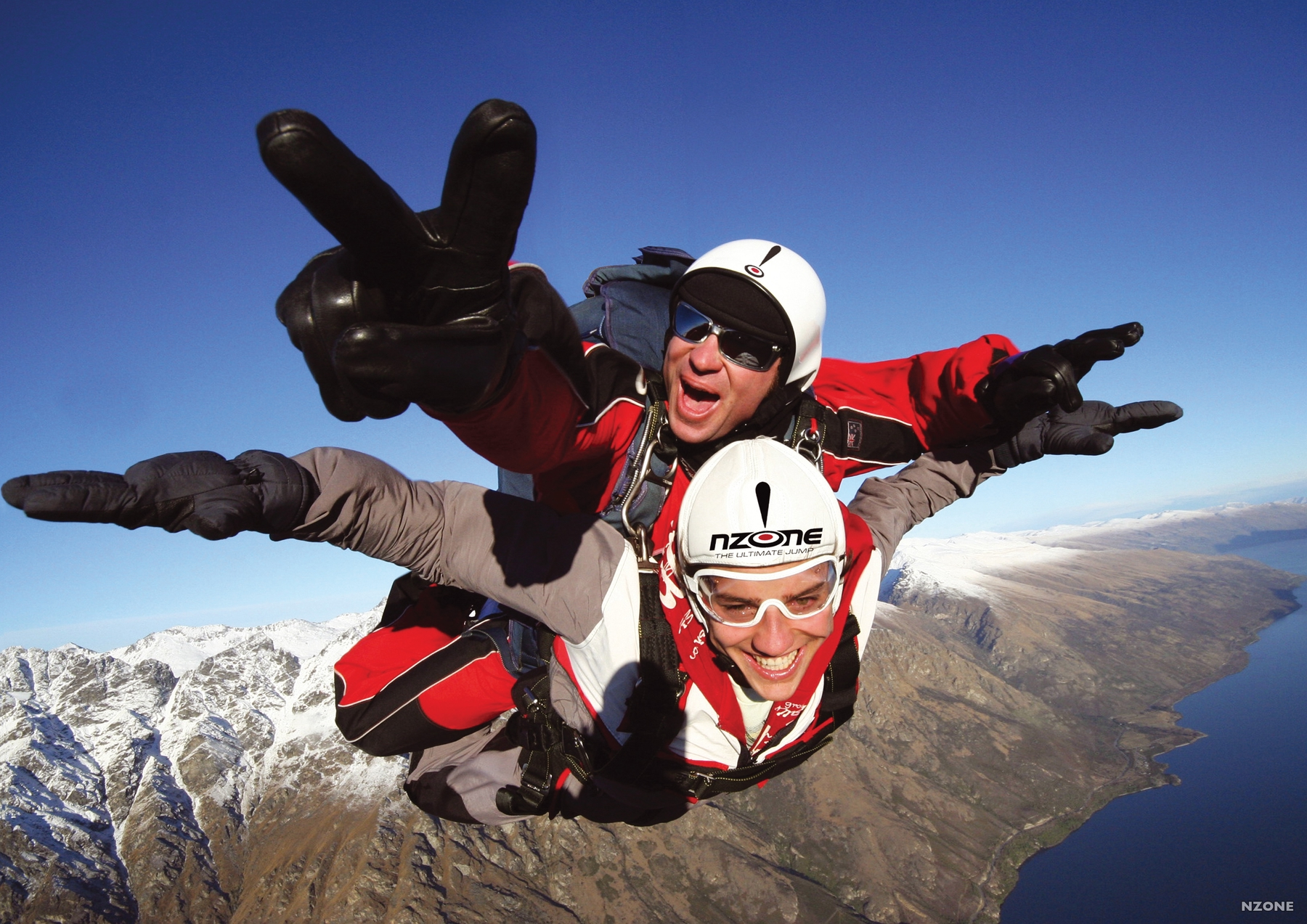 skydivers over Queenstown, New Zealand