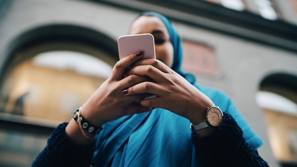 A women looking down at her phone