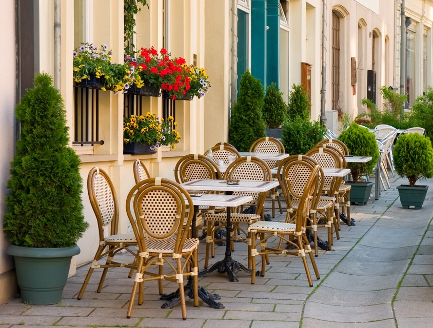 Charming rattan chairs and table at a pavement cafe in Luxembourg.