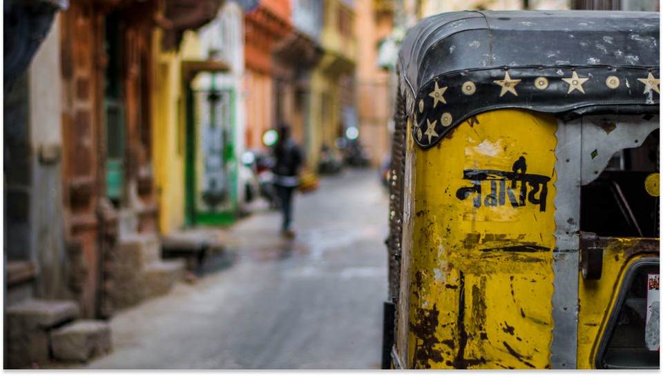 A blurred image of the local streets