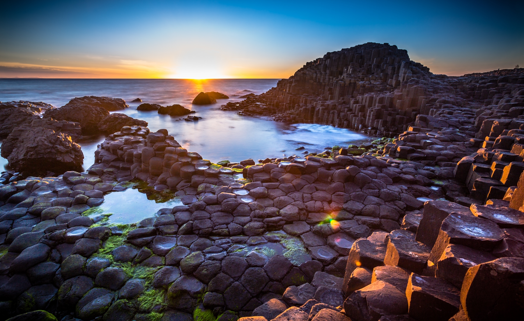 Belfast coastal view of Giant's Causeway at sunset