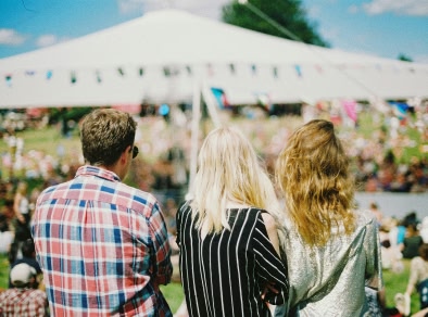 3 friends enjoying a festival.