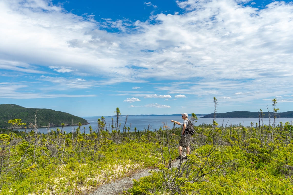 hiker walking along the Damnable Trail in the Eastport Peninsula in Newfoundland