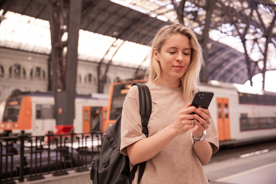 woman using global SIM to make a phone call overseas