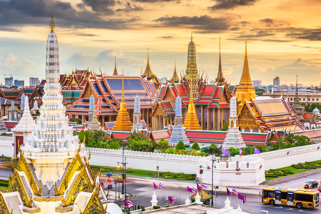 Bangkok, Thailand at the Temple of the Emerald Buddha and Grand Palace at dusk.