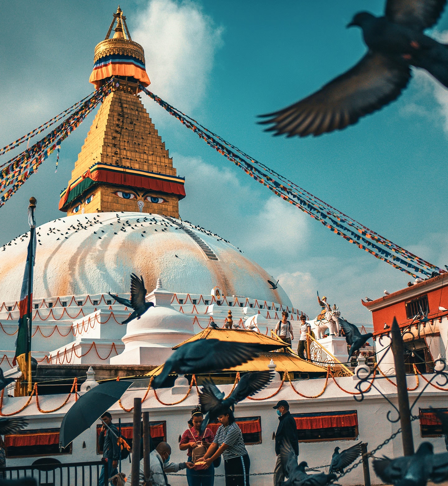 The golden peak and colourful garlands of the Swayambhu Mahachaitya temple in Kathmandu, Nepal.