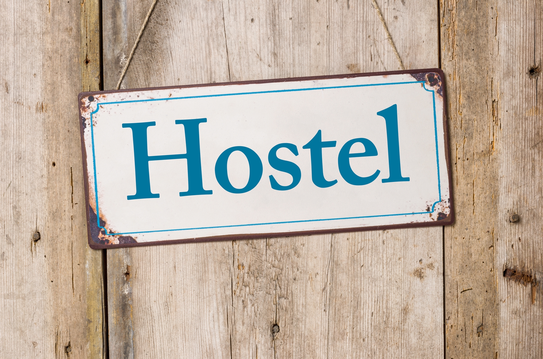 hostel sign. a great way to travel as a vegetarian is staying in a hostel with a kitchen