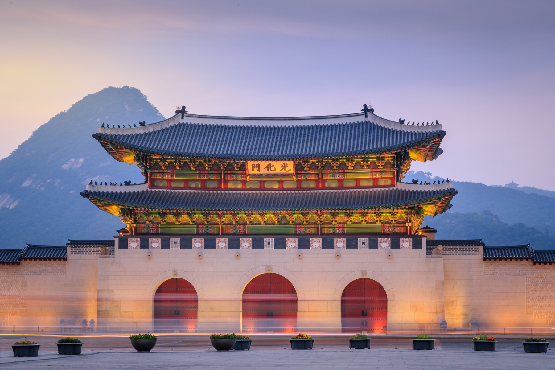 Gyeongbokgung Palace in Seoul, South Korea in the evening. South Korea is an inviting place for an extended vacation with 6-month tourist stamps for Canadians