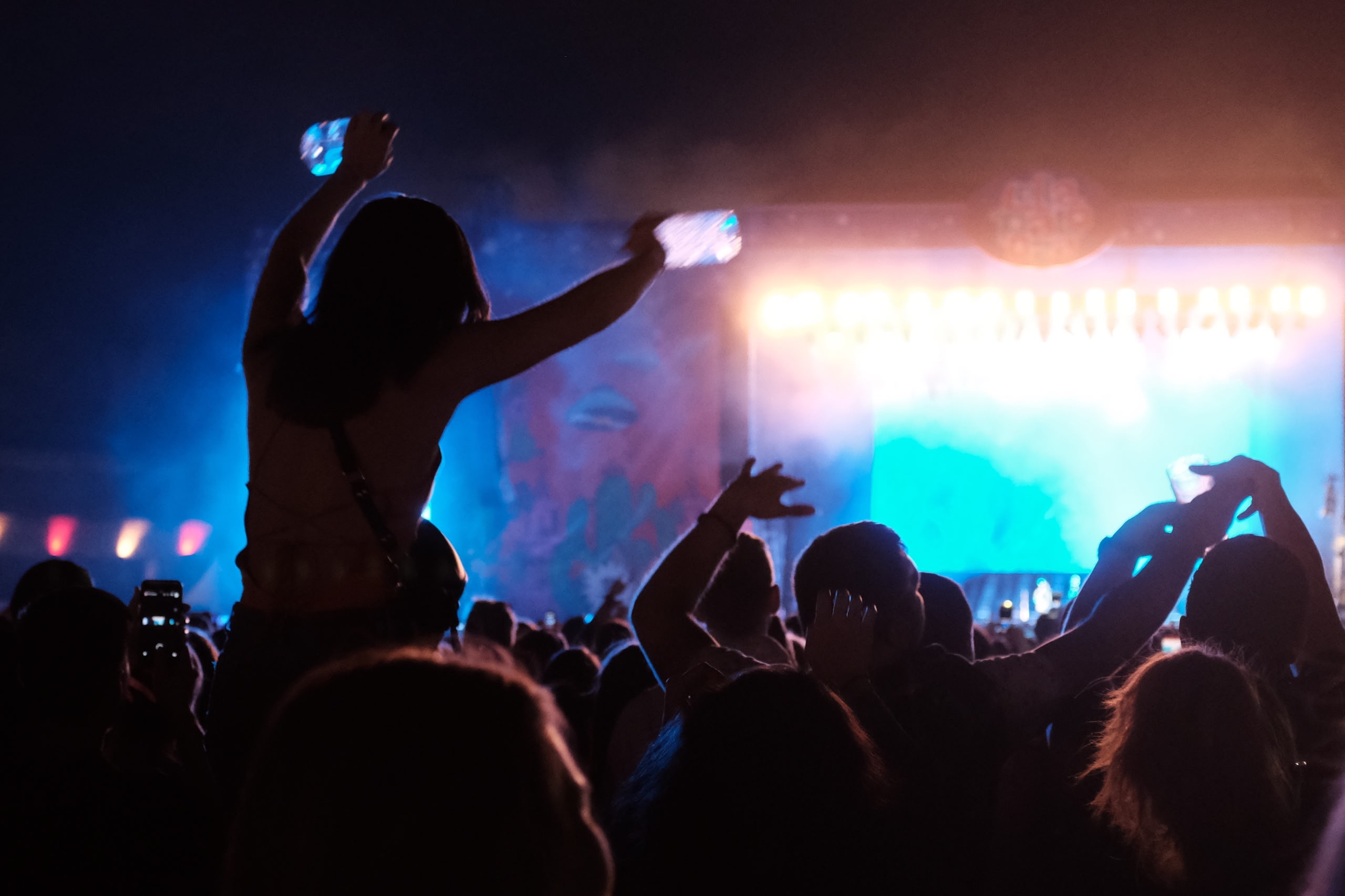 PEOPLE ENJOYING MUSIC CONCERT, summer evening.