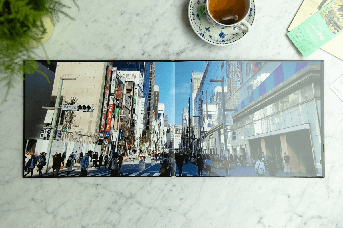 Beautiful photo book with flat lay image spread across two pages.