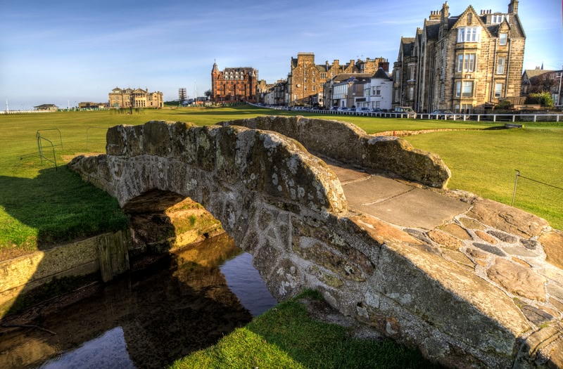 A small stone bridge, known as The Swilcan Bridge, in St Andrews Links golf course, Scotland.