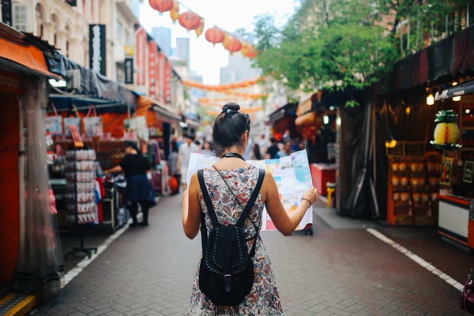 person using map abroad