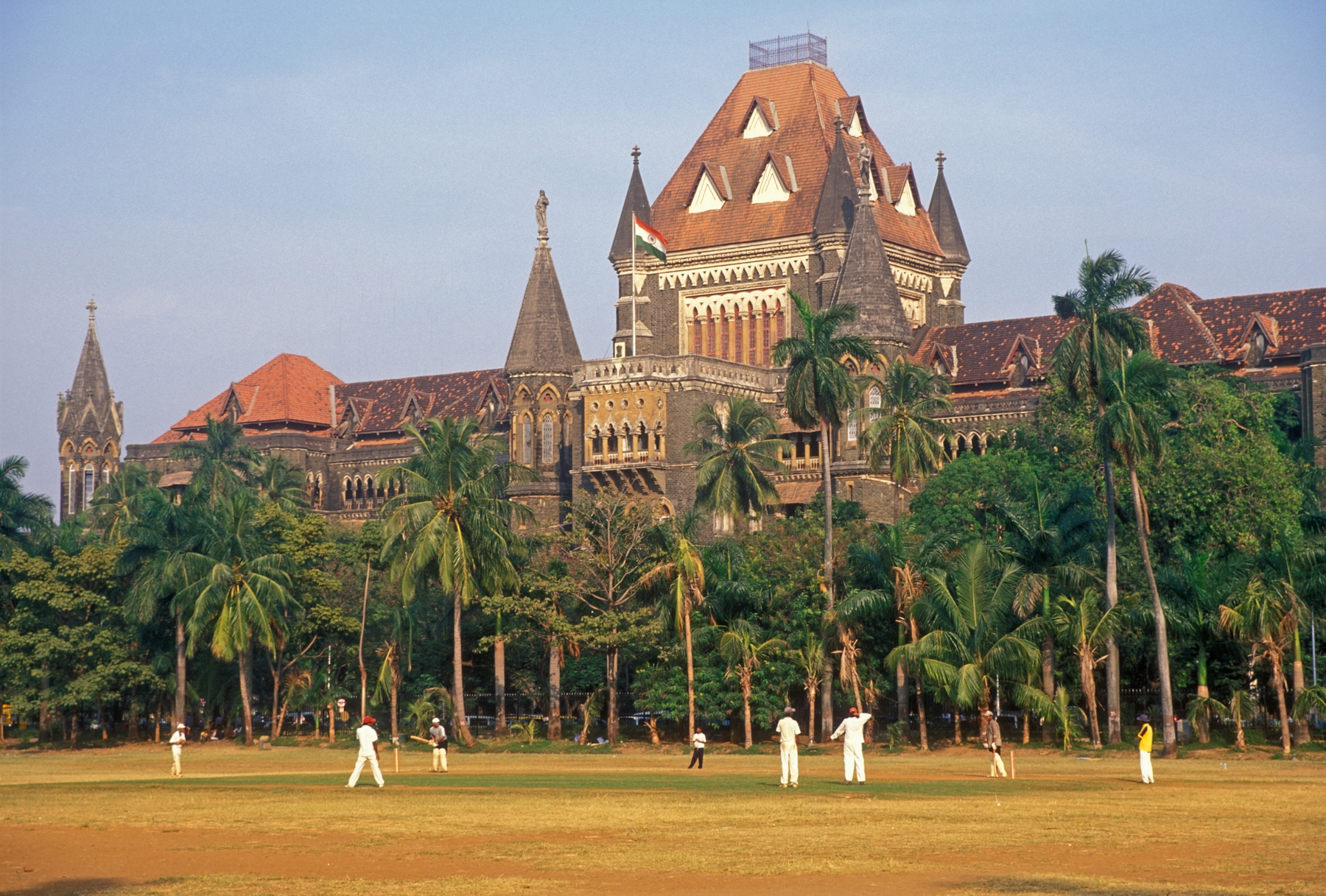 men playing croquet in front of a building in India