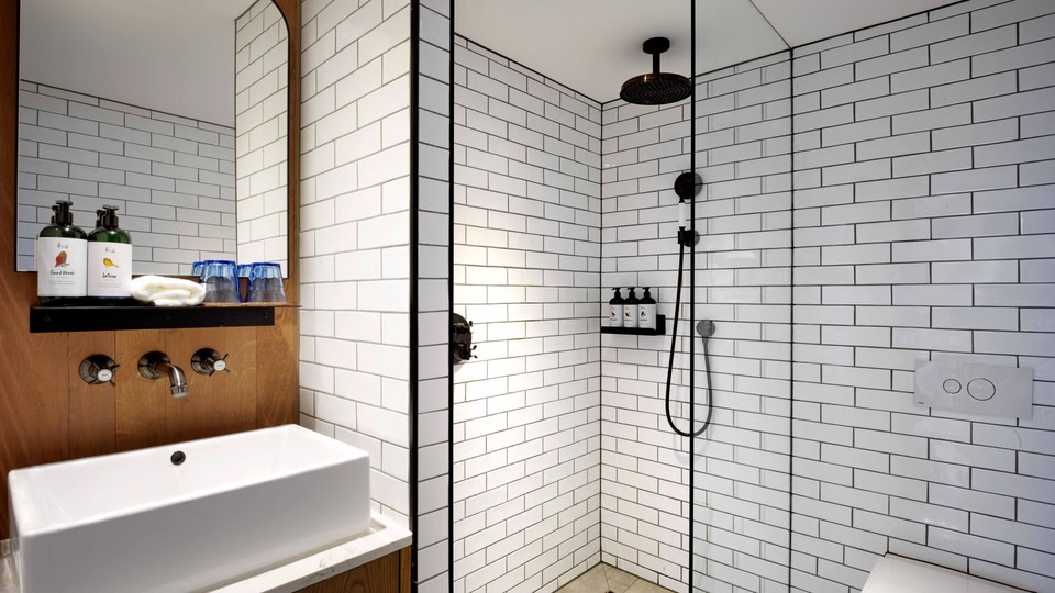 Spacious waterfall shower at Treehouse Hotel London