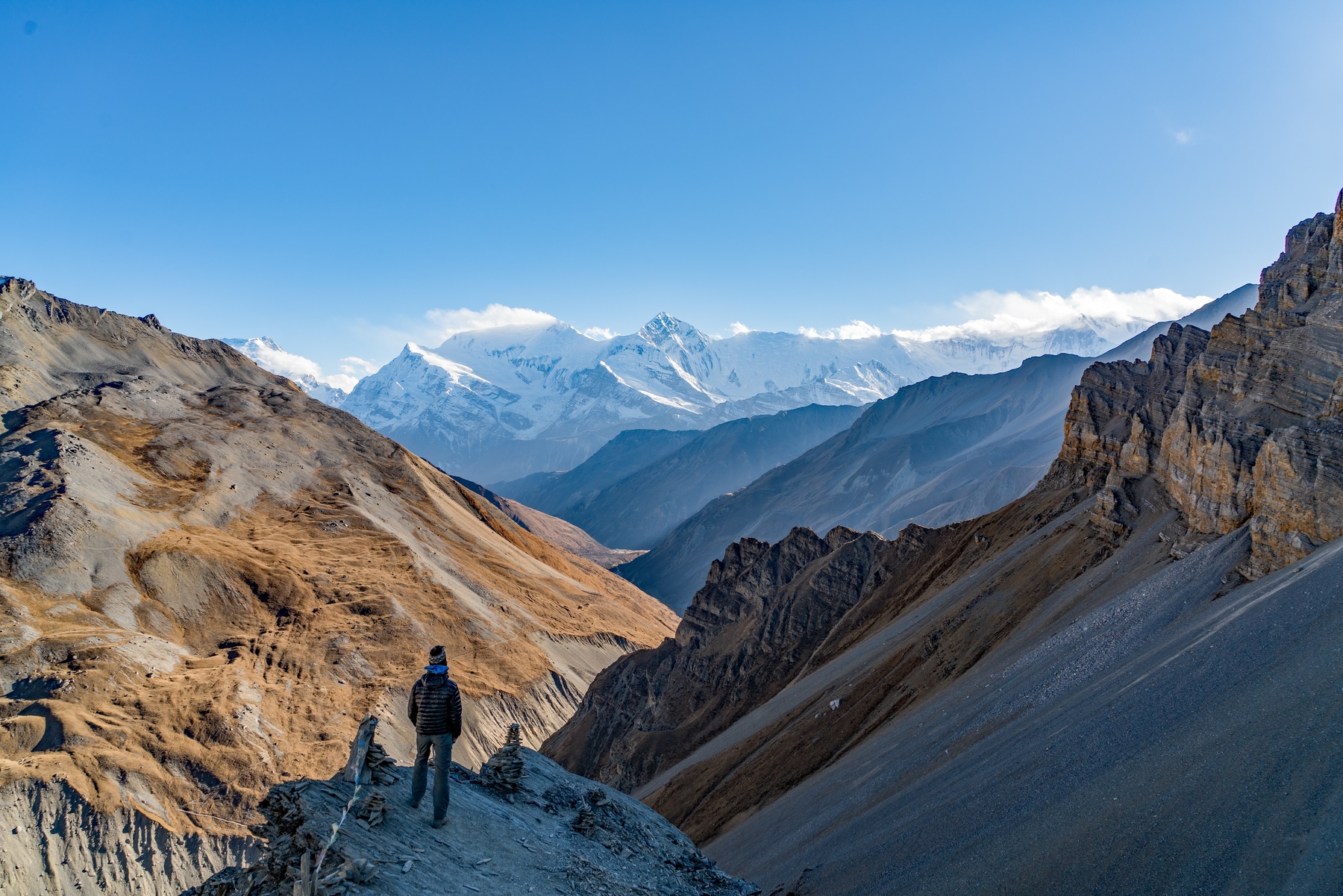 hiking from a distance looking out on a mountain range in Nepal, a dream destination