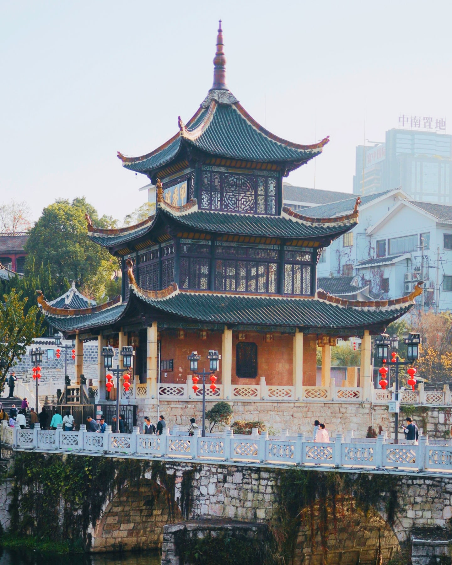 Temple by a water and bridge in Guiyang China