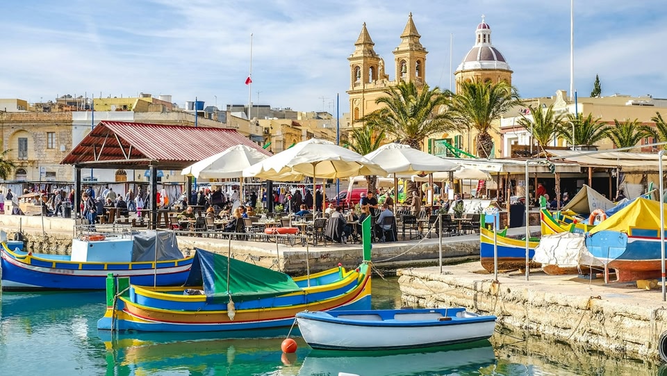  Colorful fishing boats in a Maltese harbor