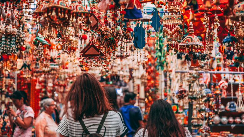A group of people walking through Little India in Singapore