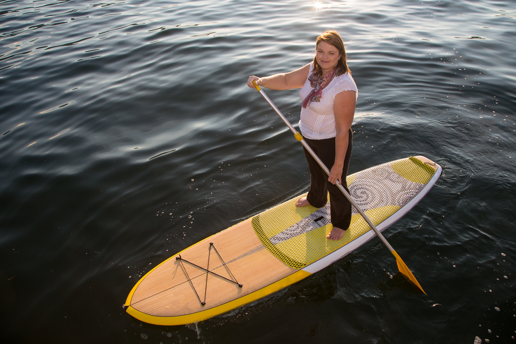 woman paddleboarding on a lake in Arizona