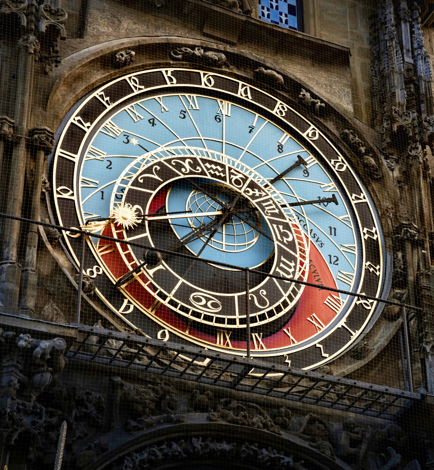 Close-up of Prague’s ornate medieval clock with zodiac and time dials.