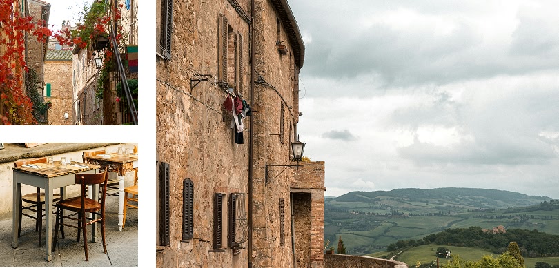 scorci di un borgo medievale: una strada stretta con fiori rossi, un tavolo e sedie all'aperto e un edificio in pietra con vista sulla campagna circostante.