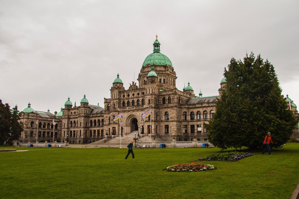 view of the exterior and lawn of the Victoria city hall in BC