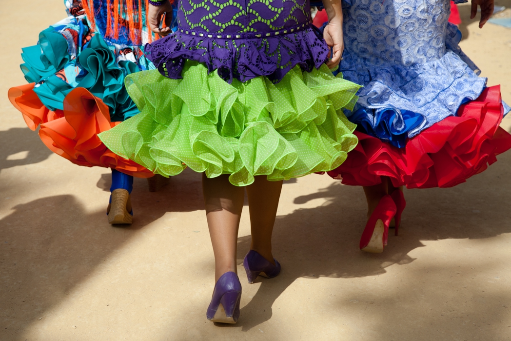 3 women wearing flamenco dresses in Andalusia, Spain