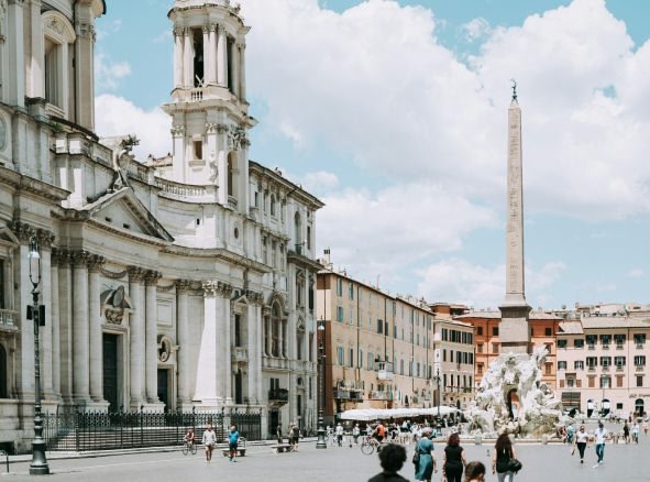 Obelisk and building exteriors in Piazza Navona.