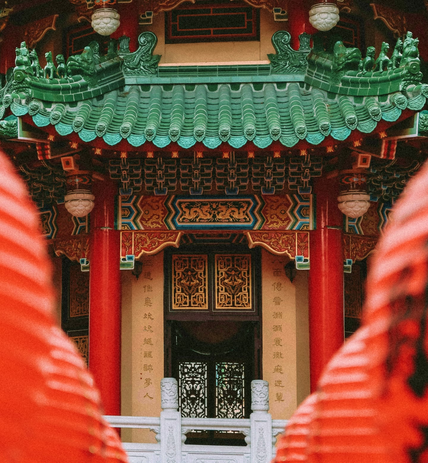 A colourful red and green entrance to a temple in Kaohsiung, Taiwan.
