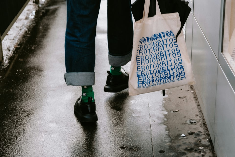 People holding a shopping bag