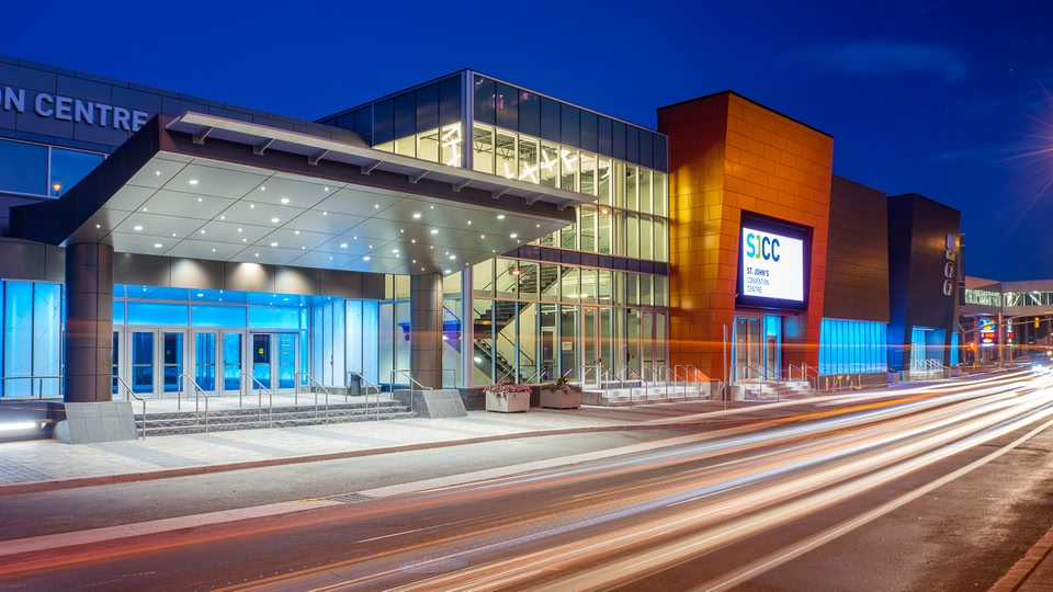 St. John's Convention Centre entrance at night with illuminated signage and architectural details.