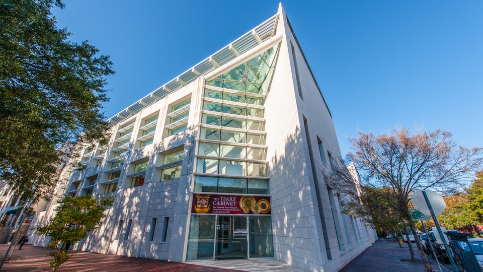 Modern museum building with glass facade and visible entrance sign in Savannah, Georgia.