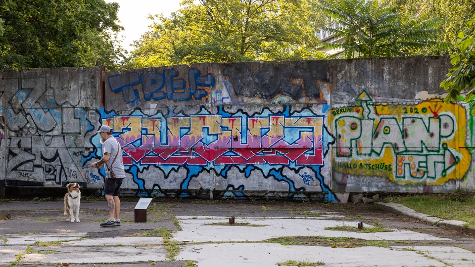 Berlin Cathedral with people walking in front during golden hour